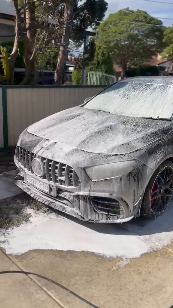 Car covered in thick snow foam during a Formula X maintenance wash
